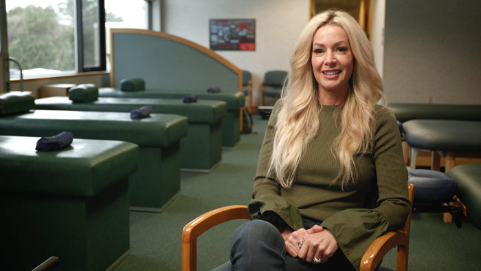 Woman at chiropractic office in Grand Rapids, Michigan.